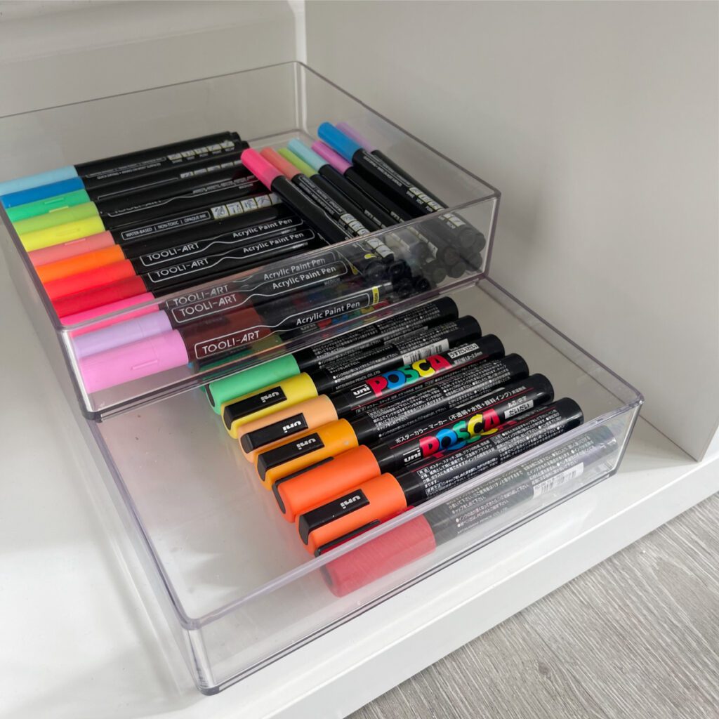 Craft Room Organization using acrylic containers to hold pens