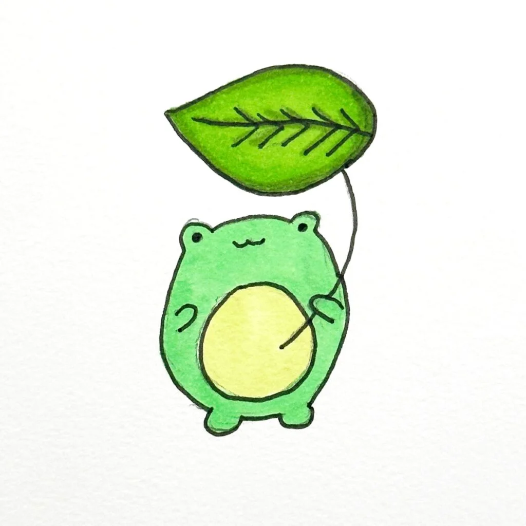 Frog holding a leaf