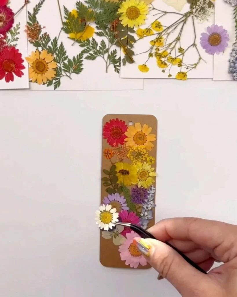 pressed flowers arranged on a bookmark