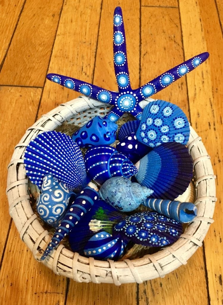 Assorted blue painted seashells