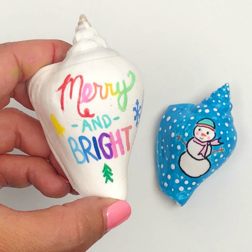 Christmas Painted Shell Ornament ideas - one says merry and bright, the other is a snowman in the snow