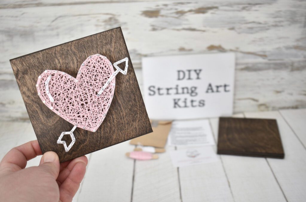 Heart string art on a wooden square