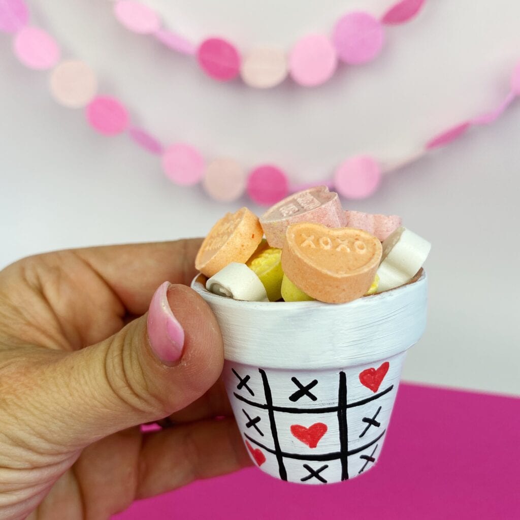 Another example of this Homemade Valentine's Day Craft. Flower Pots can be painted to look like a tic-tac-toe game and the Os are hearts