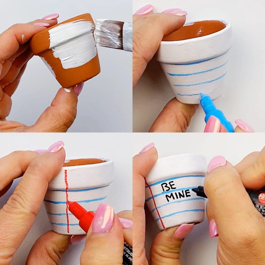 Steps for making a Flower Pot Valentine's Day Craft - First it is painted white, then horizontal lines are added with blue paint maker, followed by the red vertical line, and then be mine is written in black on the lines to look like a notebook