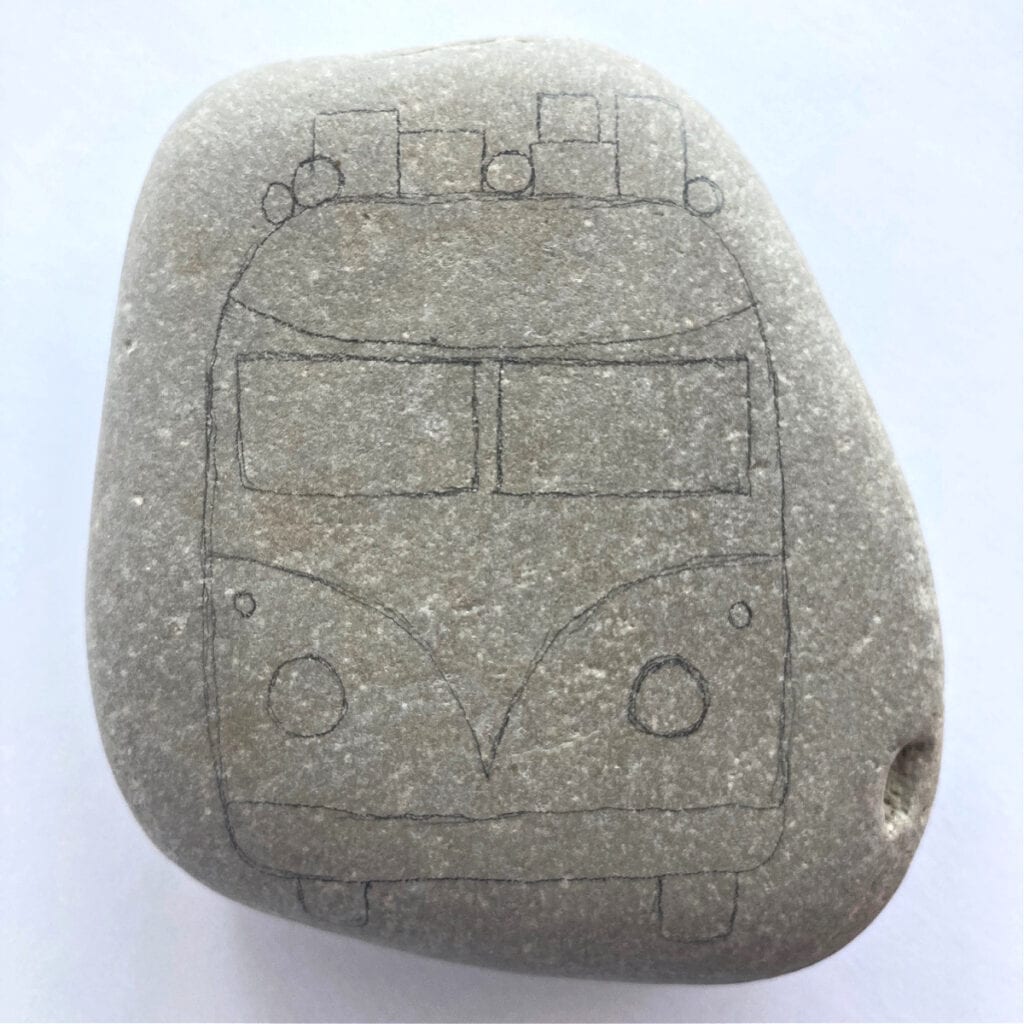 VW bus outlined on a rock with details