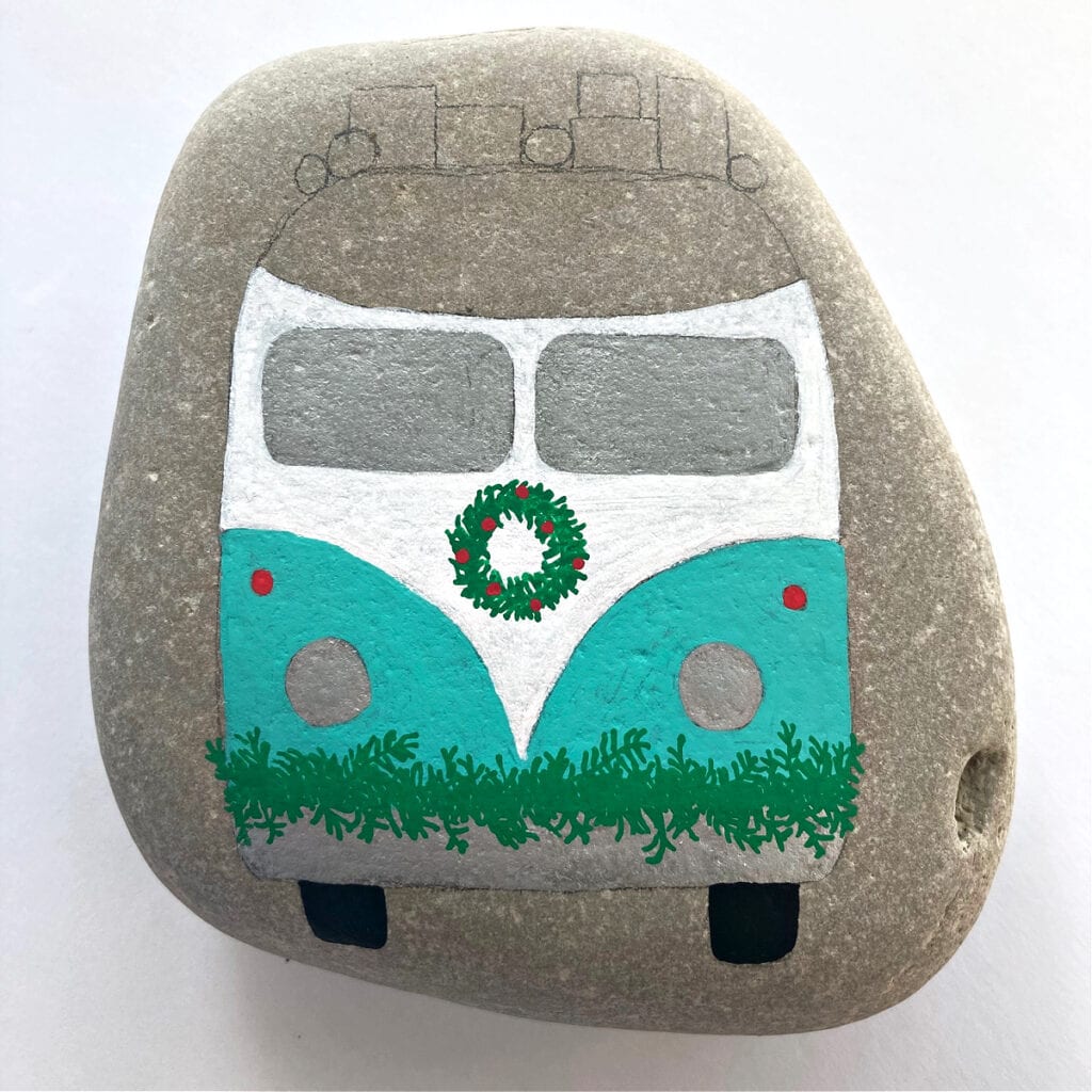 Adding Christmas decorations to our Volkswagen Bus painted rock