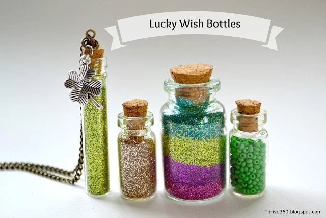 Miniature glass bottles filled with glitter and beads for wish making. 