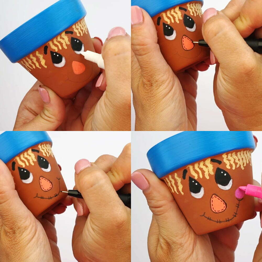 Steps for how to complete this Thanksgiving scarecrow flower pot craft - add whites to eyes, details to nose and mouth, and then pink circles on the cheeks