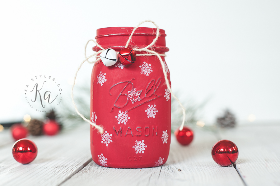 Red Christmas mason jar with painted snowflakes