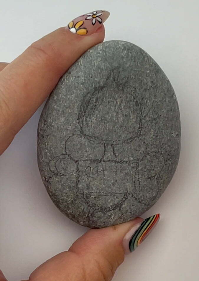 Design sketched on a rock with pencil